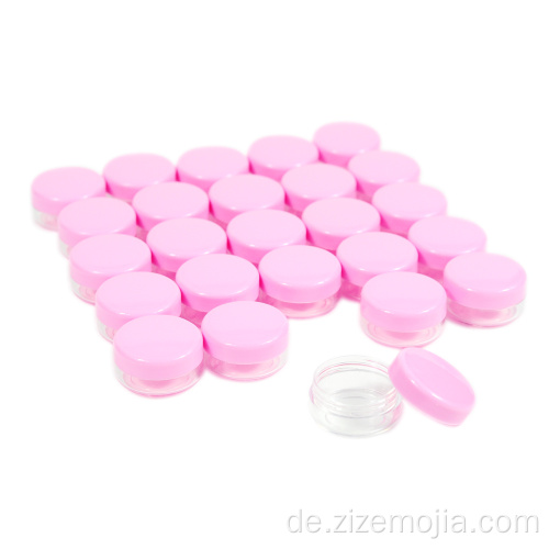 Kleine Kosmetikdose aus Kunststoff mit rosa Deckel